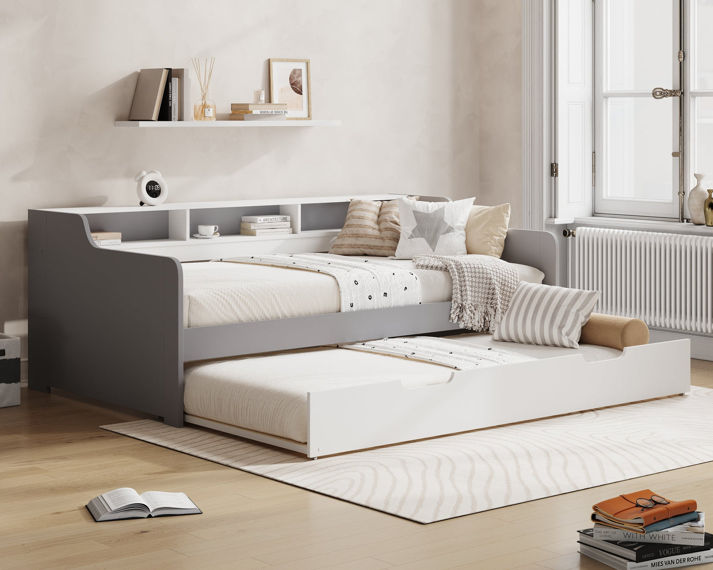 Gray bed with white bedding in a room with 'Millie & Jones' branding.