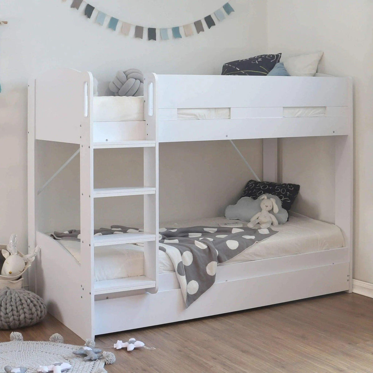 Ripley Bunk Bed in white, with the trundle closed under the bottom bunk