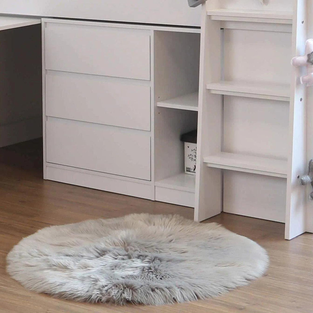 Close-up of the Ripley Mid Sleeper's chest of three drawers and open shelves in white