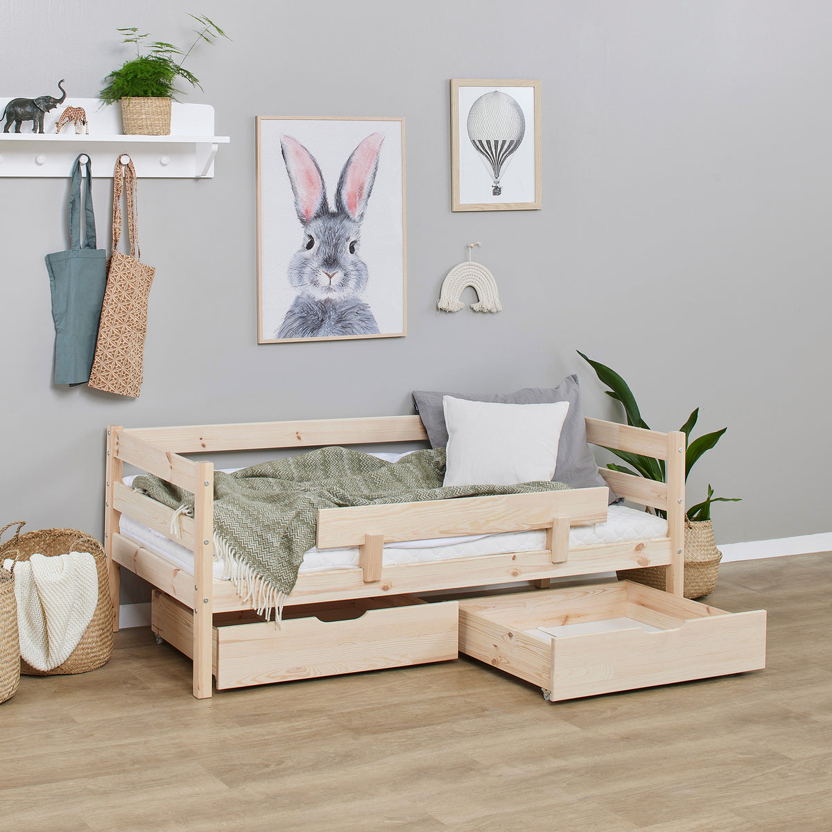 Tarn Shorty daybed in natural pine with the safety rail and both drawers out