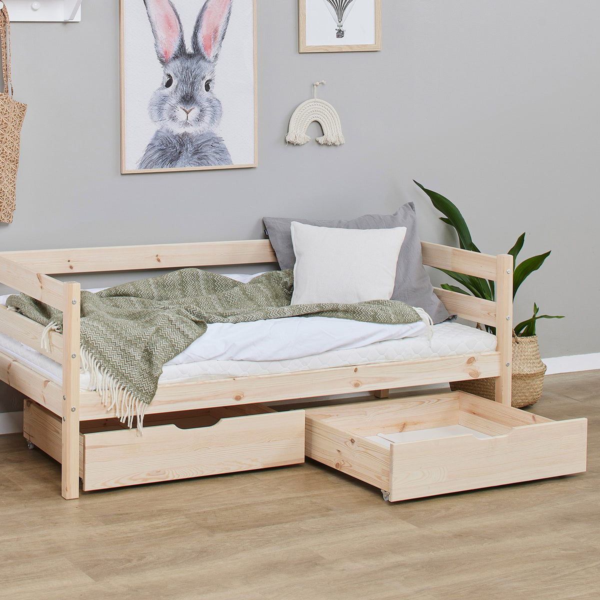 Tarn Shorty daybed in natural pine with one drawer pulled out