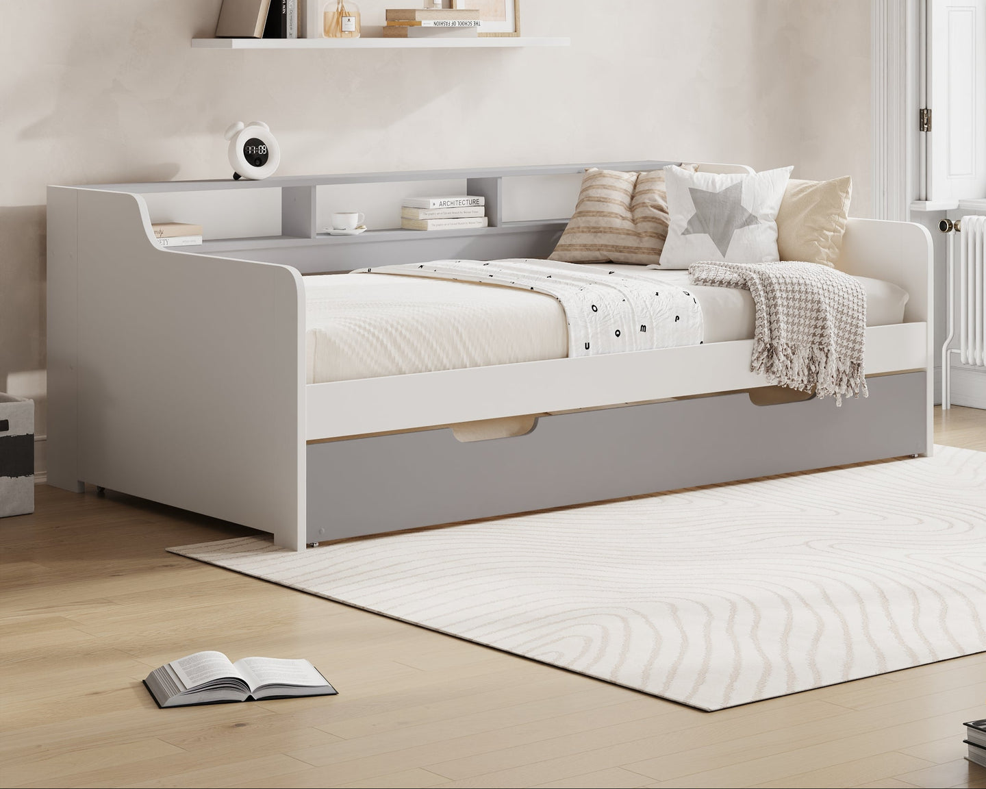Bedroom with a white bed and Millie & Jones branding on the wall.