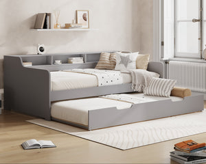Gray bed with storage drawers in a room with 'Millie & Jones' branding.