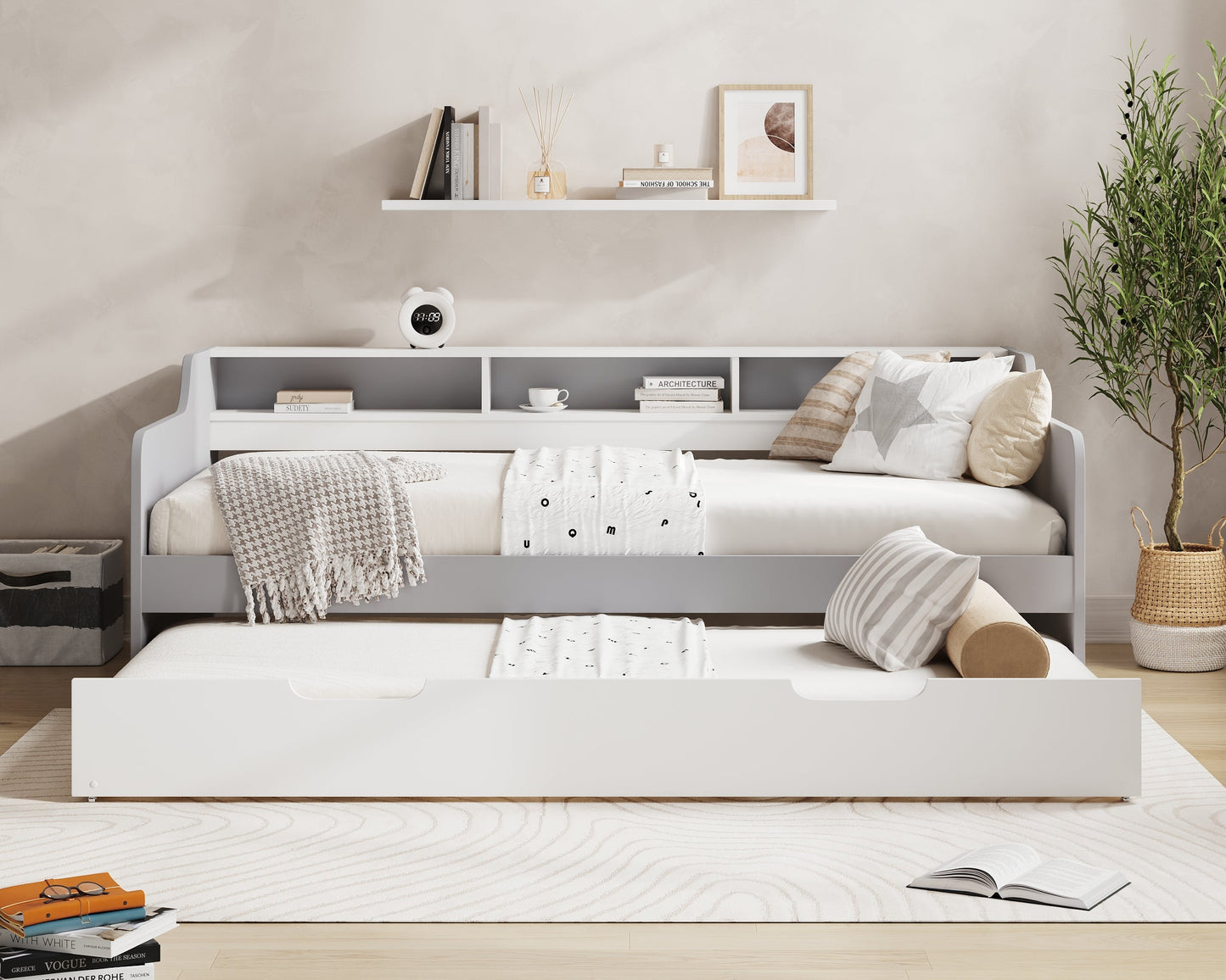 Modern bedroom with a gray bed and white shelves, featuring the brand 'Millie & Jones'.