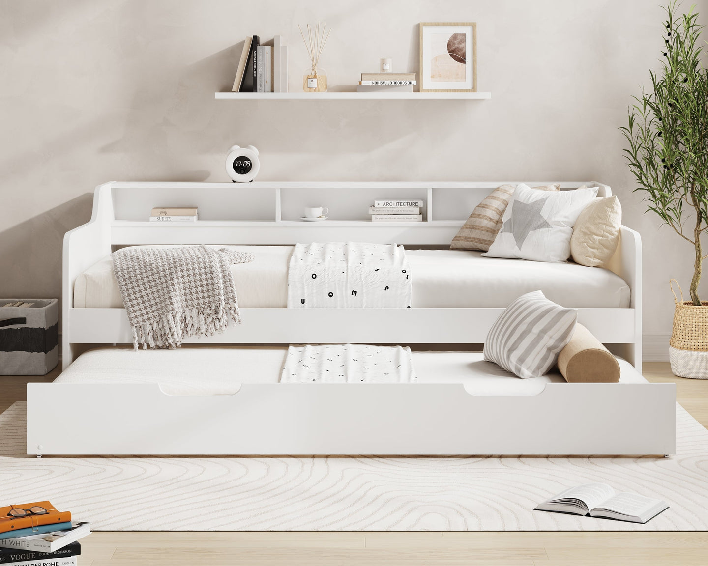 White sofa bed in a room with 'Millie & Jones' branding on the wall.