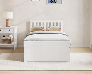 White bed in a bedroom with 'Millie & Jones' branding on the wall.
