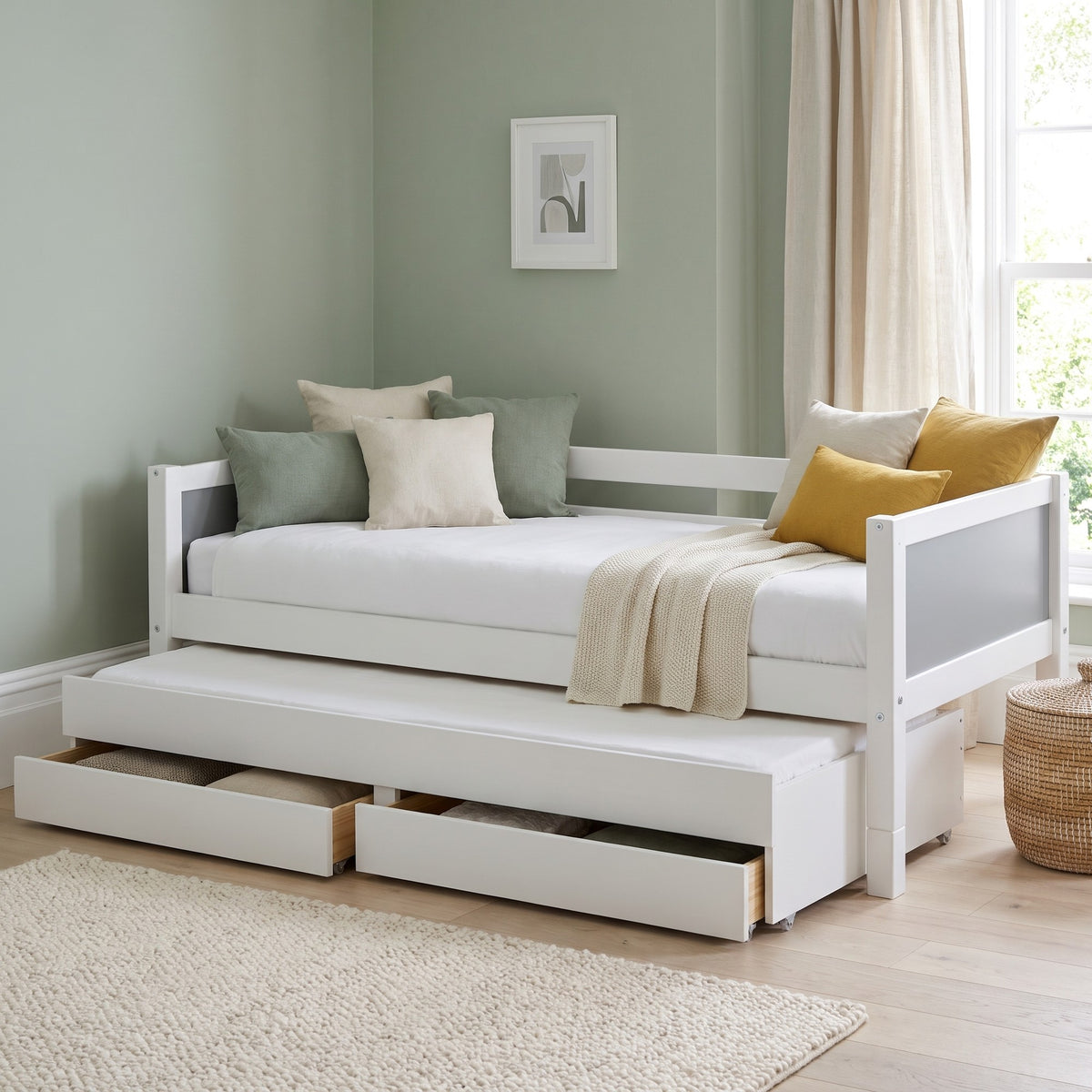 Ashdown daybed with grey head and footboard panels, trundle and drawers pulled out