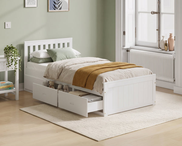 Elwood white single storage bed with two drawers open, in a sage green bedroom