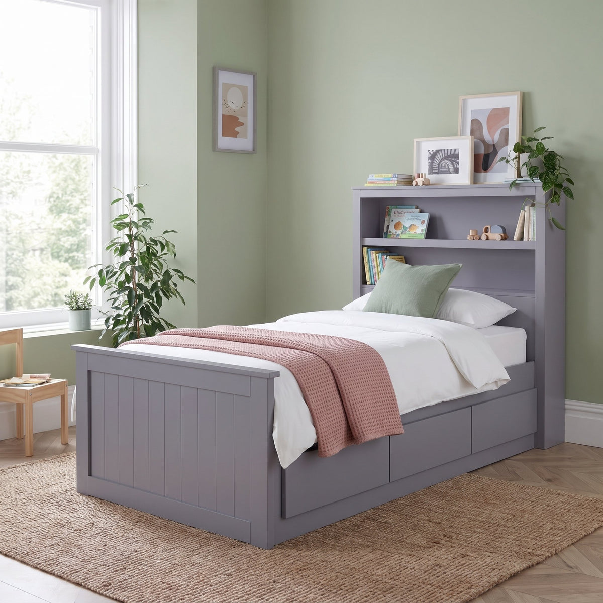 Hartley grey single storage bed with bookcase headboard and three drawers, in a sage green bedroom