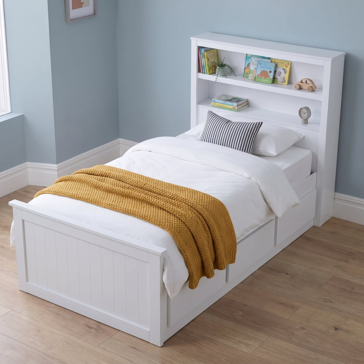 Hartley white bookcase storage bed from above, with books on the two headboard shelves