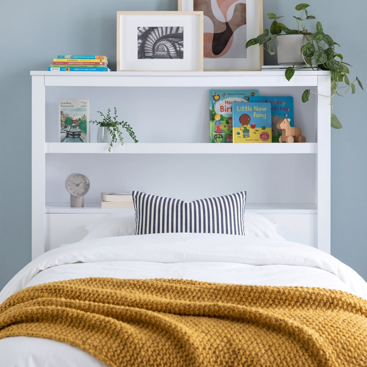 Bookcase headboard of the Hartley white bed, with two built-in shelves