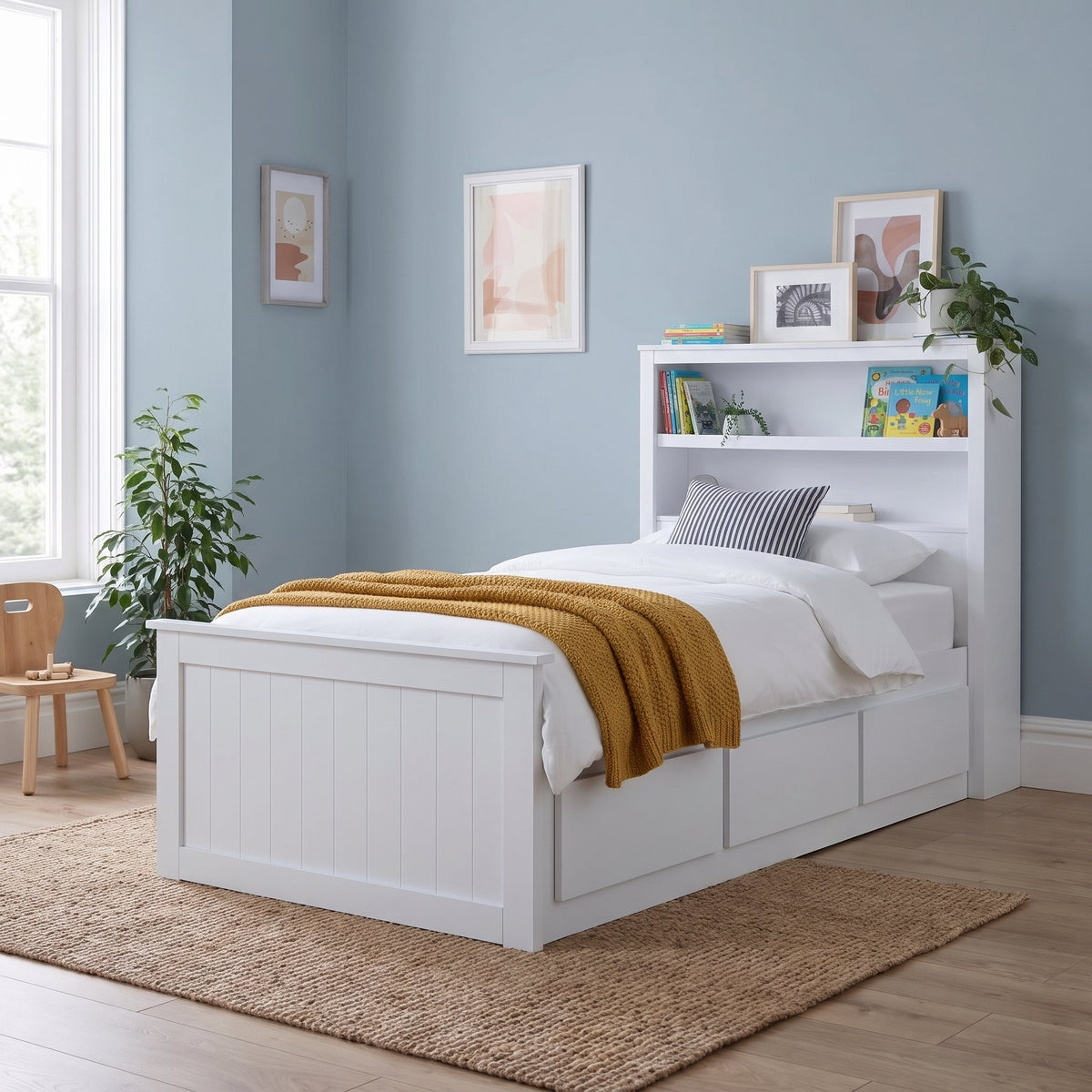 Hartley white single storage bed with bookcase headboard and three drawers, in a dusty blue bedroom