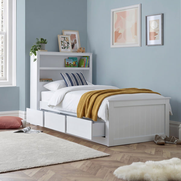 Hartley white single storage bed with bookcase headboard and three drawers, in a dusty blue bedroom