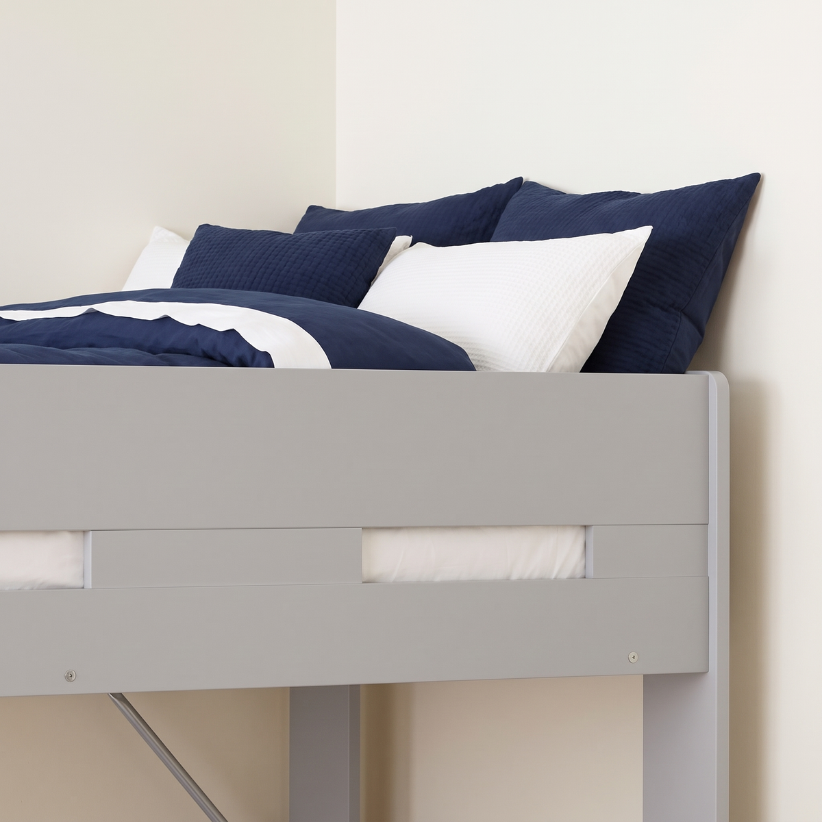 Safety guard rail around the top bunk of the grey Ripley bunk bed