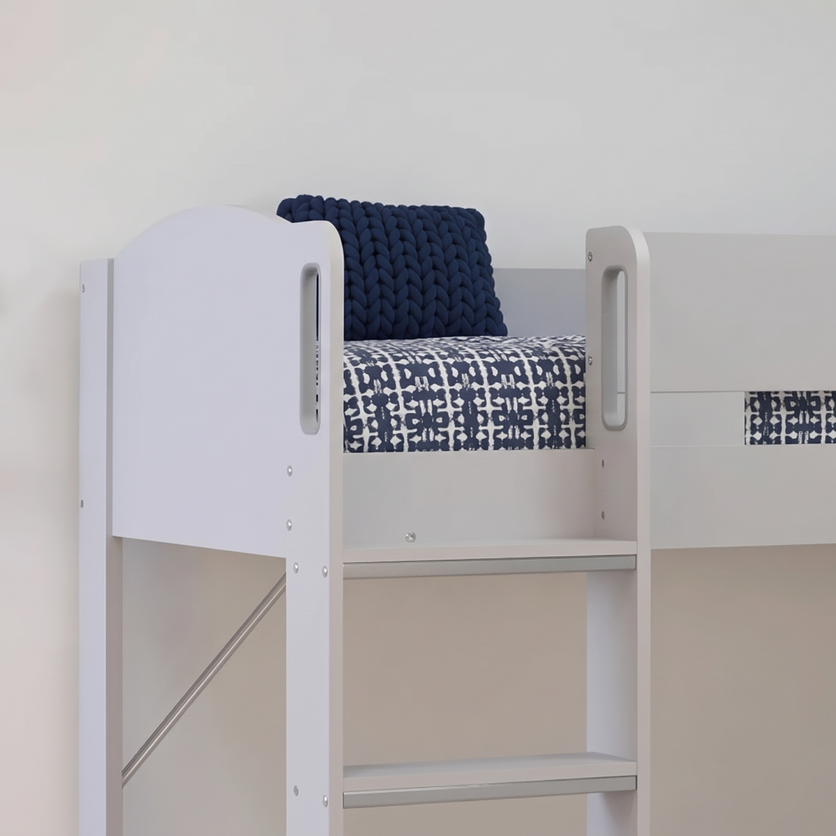Top bunk of the grey Ripley bunk bed, with the ladder and the hand-holds in the end panel